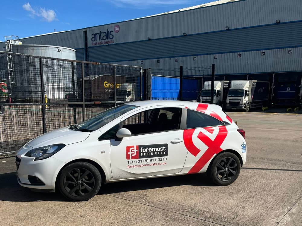 Foremost Security patrol car outside protected premises